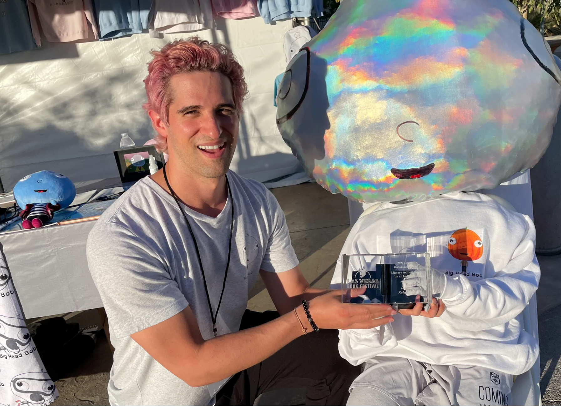 This is a picture of author David Bradley holding the Las Vegas Book Festival Award for Literary Acheivement