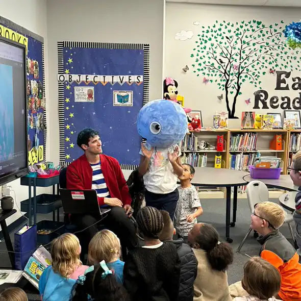 David Bradley reading Big Head Bob to a class in a school library
