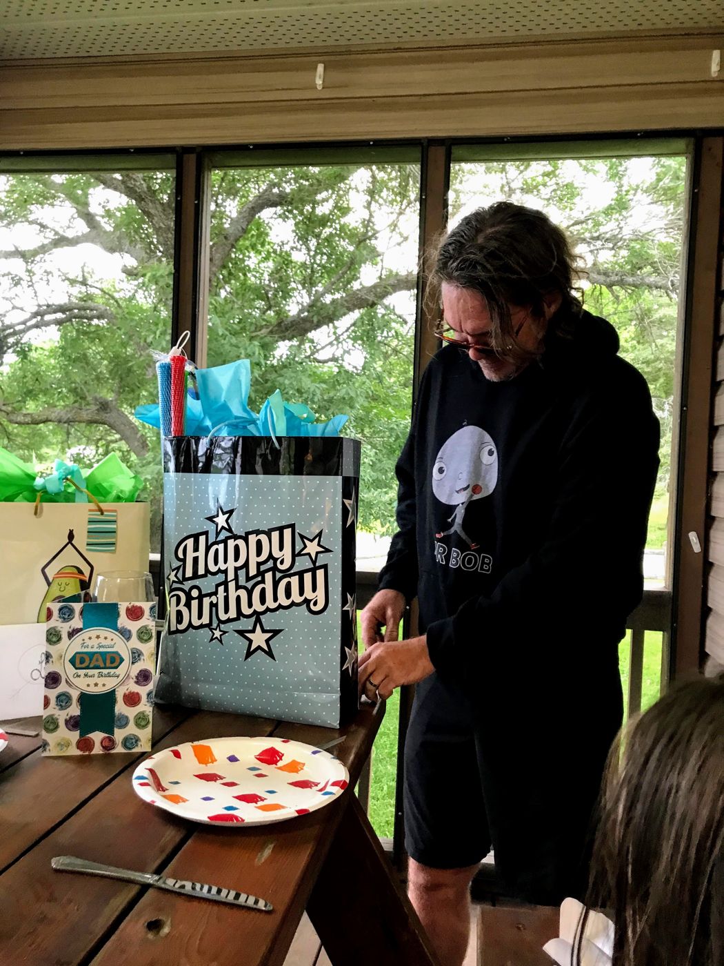 A birthday in a black Big Head Bob hoodie